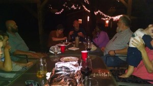 A poor pic snapped during the waning stages of our Seudat Moshiach under the Retreat Dean and Chuck recently helped me complete.  Here we have Tommy and Dorothy at the far end of the table, Reynna and Tzefanyah to their left and Chris across from his youngest son, Nathaniel in the hands of off-camera wife, Mary.  My two eldest sons are visible on the far left.  Gunnar (i) and Jeremiah.